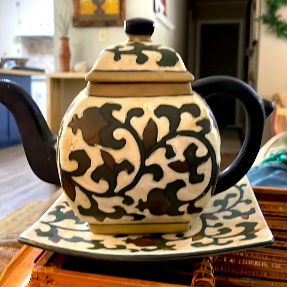 Vintage teapot, w/ tray, not for food. Dark green and brown on beige background